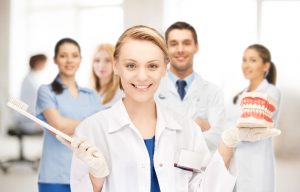 Fusion Dental Care (raleigh, Nc) Dental Team With Model Of Teeth