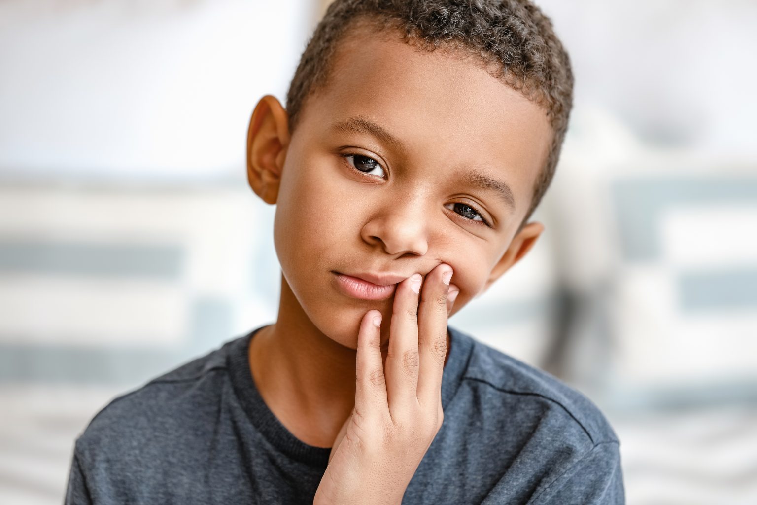 Little African American Boy Suffering From Toothache At Home