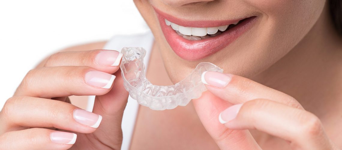 Joyful Young Woman Undergoing Clear Aligner Treatment